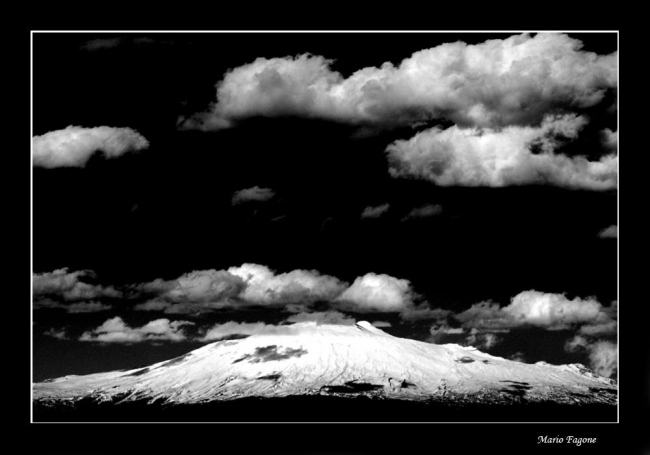 White mountain and black sky